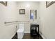 Accessible powder room featuring modern fixtures and neutral color palette at 1165 Laurel Se Pl, Smyrna, GA 30080