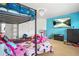 A playful ' bedroom with a bunk bed, TV, and colorful toys at 1165 Laurel Se Pl, Smyrna, GA 30080