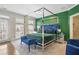 Primary bedroom with canopy bed, walkout balcony, and adjacent bath at 1165 Laurel Se Pl, Smyrna, GA 30080