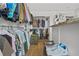 Spacious walk-in closet with custom shelving, ample storage, and hardwood floors at 1165 Laurel Se Pl, Smyrna, GA 30080
