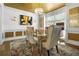 Elegant dining room with gold accents, designer chandelier, and decorative wall art at 1165 Laurel Se Pl, Smyrna, GA 30080