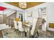Stately dining room with decorative rug, designer light fixture, and staircase at 1165 Laurel Se Pl, Smyrna, GA 30080