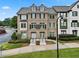 Brick townhome featuring manicured lawn and charming curb appeal at 1165 Laurel Se Pl, Smyrna, GA 30080