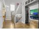 Elegant foyer with hardwood floors and staircase leading to the upper level, showcasing open design at 1165 Laurel Se Pl, Smyrna, GA 30080