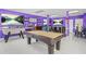 Fun-filled game room with pool table, foosball, and stylish purple decor at 1165 Laurel Se Pl, Smyrna, GA 30080