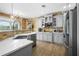Contemporary kitchen with white marble countertops, stainless steel appliances, wood floors and ample cabinet space at 1165 Laurel Se Pl, Smyrna, GA 30080