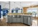 Bright eat-in kitchen with stainless appliances, stone backsplash, and farmhouse sink at 1165 Laurel Se Pl, Smyrna, GA 30080