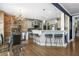 Eat-in kitchen featuring modern countertops, pendant lighting, stainless steel appliances, and a dining area at 1165 Laurel Se Pl, Smyrna, GA 30080