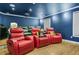 Home theater with plush seating, projector screen, and surround sound system for immersive movie experience at 1165 Laurel Se Pl, Smyrna, GA 30080