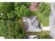 Aerial view of house featuring mature trees, and backyard patio set at 1297 Hadaway Trl, Lawrenceville, GA 30043
