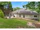 Backyard with patio set, bbq grill, and steps leading to upper yard at 1297 Hadaway Trl, Lawrenceville, GA 30043