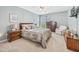 Bright bedroom with natural light, carpet, and a comfortable seating area by the window at 1297 Hadaway Trl, Lawrenceville, GA 30043