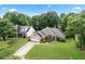 Charming single-story brick home with an attached garage, a manicured lawn, and lush landscaping at 1297 Hadaway Trl, Lawrenceville, GA 30043