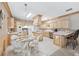 Spacious kitchen boasts light wood cabinets, stainless appliances, tiled floors, and a cozy breakfast nook at 1297 Hadaway Trl, Lawrenceville, GA 30043