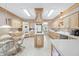 Well-equipped kitchen with light wood cabinets, stainless steel appliances, and a functional central island at 1297 Hadaway Trl, Lawrenceville, GA 30043