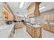 Open kitchen design with an island cooktop, light cabinets, and seamless flow to the living area at 1297 Hadaway Trl, Lawrenceville, GA 30043