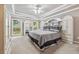 The beautiful main bedroom is spacious and bright, featuring a tray ceiling and serene decor at 1297 Hadaway Trl, Lawrenceville, GA 30043