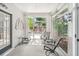 Bright sunroom featuring neutral flooring, white walls, and outdoor patio access through sliding glass doors at 1297 Hadaway Trl, Lawrenceville, GA 30043