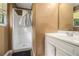 Bathroom featuring a walk-in shower and a vanity at 3953 Dalhouise Ln, Decatur, GA 30034