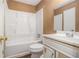 Bathroom featuring a white shower-tub combo and a white vanity with mirror at 3953 Dalhouise Ln, Decatur, GA 30034