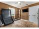 Bedroom with a ceiling fan, window, mounted TV, and carpet flooring at 3953 Dalhouise Ln, Decatur, GA 30034