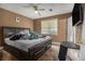 Bedroom with a ceiling fan, window, and a large bed at 3953 Dalhouise Ln, Decatur, GA 30034