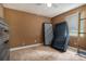 Bedroom with a ceiling fan, window, and carpet flooring at 3953 Dalhouise Ln, Decatur, GA 30034
