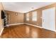 Bright living room with hardwood floors, neutral walls and natural light from the windows at 3953 Dalhouise Ln, Decatur, GA 30034