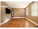 Inviting living room with hardwood floors, neutral walls, and sunny window views at 3953 Dalhouise Ln, Decatur, GA 30034