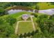 Beautiful estate with expansive lawn and pond, providing stunning views from above at 833 Hines Rd, Moreland, GA 30259
