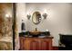 Bathroom with vanity, decorative mirror, and stylish lighting at 833 Hines Rd, Moreland, GA 30259