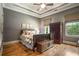 Bedroom with hardwood floors, tray ceiling, and natural light at 833 Hines Rd, Moreland, GA 30259