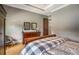 Bedroom with hardwood floors, a dresser with decor, and natural light at 833 Hines Rd, Moreland, GA 30259