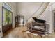 Grand foyer with hardwood floors, staircase, piano, and double door entrance creating an inviting ambiance at 833 Hines Rd, Moreland, GA 30259