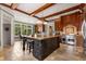 Gourmet kitchen featuring a large island, custom cabinets, and professional appliances at 833 Hines Rd, Moreland, GA 30259