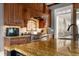 Gourmet kitchen with granite counters, stainless steel stove, and custom wood cabinets at 833 Hines Rd, Moreland, GA 30259