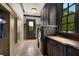 Well-appointed laundry room with granite countertops, custom cabinets, and modern washer and dryer at 833 Hines Rd, Moreland, GA 30259