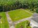 Expansive lawn surrounded by mature trees offering a park-like setting and privacy at 833 Hines Rd, Moreland, GA 30259