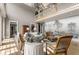 Bright living room featuring high ceilings, chandelier, and scenic mural wall at 833 Hines Rd, Moreland, GA 30259