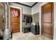 Charming mudroom featuring coat racks, storage bench, and neutral wall paint at 833 Hines Rd, Moreland, GA 30259