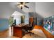 Sun-filled home office with custom built-in bookcases, hardwood floors, and wainscotting at 833 Hines Rd, Moreland, GA 30259