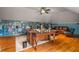Spacious office features hardwood floors, custom bookcases and a comfortable seating area at 833 Hines Rd, Moreland, GA 30259