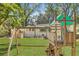 Spacious backyard featuring lush lawn and play equipment, perfect for outdoor activities and Gathering fun at 1343 Peachtree Battle Nw Ave, Atlanta, GA 30327