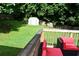 Landscaped backyard with grass and a shed, viewed from a deck with outdoor seating at 3464 Navaho Se Trl, Smyrna, GA 30080