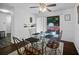Dining room with a glass table and view of the backyard with outdoor seating area at 3464 Navaho Se Trl, Smyrna, GA 30080