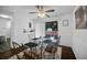 Bright dining room featuring a glass-top table, stylish chairs, and sliding glass doors to the backyard at 3464 Navaho Se Trl, Smyrna, GA 30080