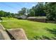 Well-maintained house with a large front yard, a long driveway, and mature trees surrounding the property at 3464 Navaho Se Trl, Smyrna, GA 30080