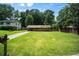Charming home with a spacious front yard, a well-manicured lawn, and mature trees at 3464 Navaho Se Trl, Smyrna, GA 30080