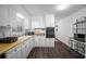 Efficient kitchen features white cabinets, wood countertops and updated vinyl flooring at 3464 Navaho Se Trl, Smyrna, GA 30080