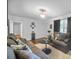 Comfortable living room featuring a ceiling fan and plush seating, perfect for relaxation at 3464 Navaho Se Trl, Smyrna, GA 30080